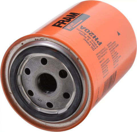 Close-up of Extra Guard PH20A oil filter showing metal base and orange casing for 10K mile change interval