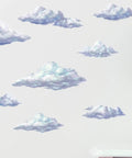 Sky Cloud Wall Decals Kit For Kids Rooms And Nurseries, Peel And Stick Cloud Mural Art next to a blue lamp on a white table