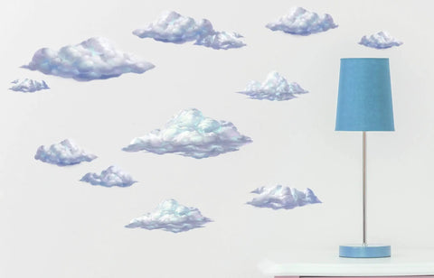 Sky Cloud Wall Decals Kit For Kids Rooms And Nurseries, Peel And Stick Cloud Mural Art next to a blue lamp on a white table