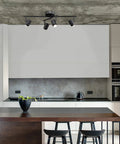 Walton 4-Light Integrated LED Track Lighting System in Matte Black, Center Swivel Bar, 1800 Lumens, shown in modern kitchen