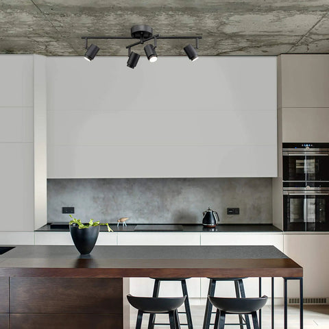 Walton 4-Light Integrated LED Track Lighting System in Matte Black, Center Swivel Bar, 1800 Lumens, shown in modern kitchen