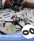 Technician installing M3 Rubber Flat Washer 6mm OD 3mm ID 1mm Thick Anti Vibration Gasket for RC flight controllers and drones.