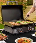 Heat Resistant Countertop And Grill Mats For Outdoor Grilling Up To 550 Degrees Fahrenheit Fireproof Table Protector 24 X 31 Inch 0.02 Inch Thick Mess Free Cleanup For Charcoal And Gas Grills Works With Blackstone And Ninja under an outdoor grill with various foods