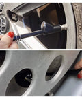 GODESON blue dual-head pencil tire pressure gauge, handheld tool for car tire valve, beside Toyota emblem on wheel hub.