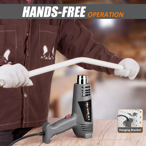 Beast 1600W Heat Gun With Dual Temperature Control being used hands-free for bending white PVC pipe in workshop.
