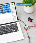 Laptop connected to 16 Channel PWM Servo Tester Board With Over Current Protection And USB Port For DIY Bots next to servos