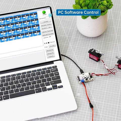 Laptop connected to 16 Channel PWM Servo Tester Board With Over Current Protection And USB Port For DIY Bots next to servos