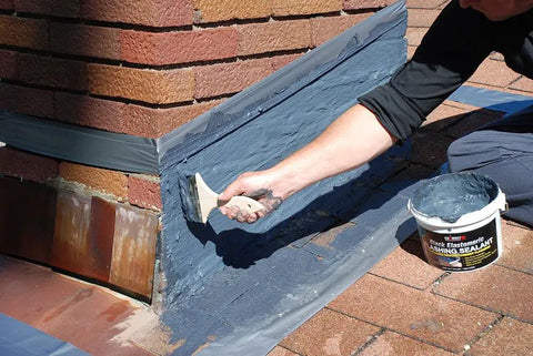 Applying Brushable Black Elastomeric Chimney Flashing Sealant For Waterproof Leak Protection Around Chimneys, Vents And Skylights, Flexible And Stays Flexible Coating That Bonds To Shingles And Bricks And More In A Half Gallon to brick chimney flashing