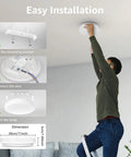 Man installing Slim Flush Mount LED Ceiling Light 2400 Lumens, 200 Watt Equivalent, IP54, 3000K fixture with easy install guide.