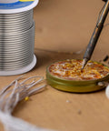 Two Pack Sn60 Pb40 Rosin Core Solder Wire For Electrical Soldering And Home DIY 2 mm Diameter 500 G Total Easy Melt shown with iron