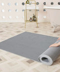 Commercial Drainage Mat 3x10 Ft 0.22 Inch Thick Grippy Non Slip PVC Floor Rug unrolled in bathroom, gray durable mat