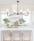Classic Linear Linen Pendant Light With Off White Fabric Shade 4 Light Sleek Modern Kitchen Island Chandelier over a white kitchen