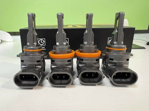 H11 H9 And 9005 HB3 Light Bulbs Combo Pack Of 4, 120000 Lumen Output, shown on table in front of its packaging