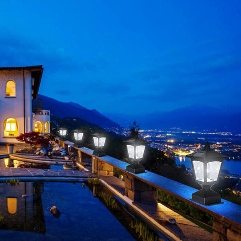 Night view with Outdoor Solar Powered Post Cap Lights For 4x4 Wood Posts, illuminating a deck with a scenic mountain background.