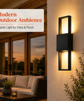 Modern Outdoor Wall Sconce 2 Pack, Up Down LED Light, 3000K, Hardwired illuminating a patio with soft warm light.