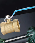 Heavy Duty Solid Brass Ball Valve With Double Internal Thread One Point Five Inch Straight Through Shut Off For Plumbing Lines, angled view.