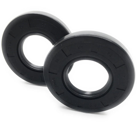 Close-up of two black rubber oil seals, 25 x 52 x 7 mm, double‑lip TC style rotary shaft seals.