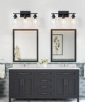 Top Shelf Matte Black Three Light Bathroom Vanity Fixtures With Clear Glass Shades, mounted above dual mirrors in modern bathroom.