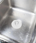 Close-up of 4pcs Rubber Bathtub Drain Stopper with Pull Ring fitted in a stainless steel sink, showcasing its waterproof seal.