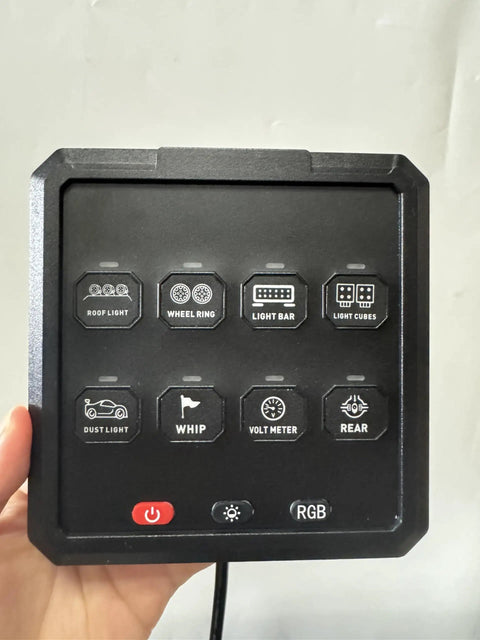 8 Gang Electronic Switch Panel For 12V Systems With LED Indicators And Remote Control, hand holding panel from front view