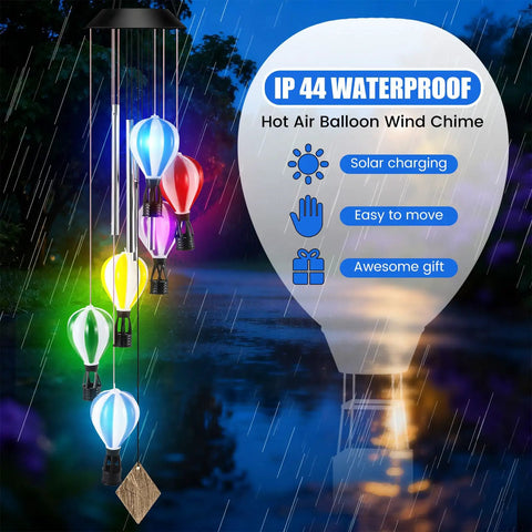 Solar Wind Chimes Outdoor Decor With Hot Air Balloon Lights Waterproof Garden Patio Lighting Lit At Night Perfect Gift For Mothers Day Mom Grandma Birthday. Multicolor hot air balloons glow at night in rainy garden setting.
