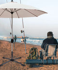 Heavy Duty Foldable Beach Umbrella Stand With Universal Clamp That Fits Poles From One Inch To One And A Half Inches on sandy beach