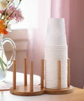 Freestanding Cup Dispenser And Storage Rack With 6 Hooks Wooden Frame And Gold Tone Wire Portable Table Cup Holder For Office Or Home Keeps Glasses And Cups Organized Dries Fast Easy To Clean And Decor Ready; stack of cups and wooden frame on table