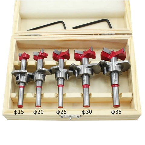 5-piece tungsten carbide hinge drill bit set in wooden case; sizes 15–35 mm with red tops.