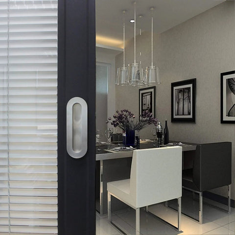 Stainless Steel Oval Recessed Sliding Door Flush Pull Handle 120mm By 40mm Brushed Satin Nickel Finish 304 Stainless Steel With Concealed Screws Pack Of 2 For Pocket Doors Barn Doors Suitable For Sliding Wardrobe Doors And Modern Interiors in a modern dining room setting