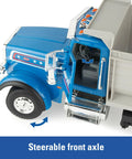 Blue Peterbilt 1/16 Scale Dump Truck Toy With Working Dump Bed 20 Inch Construction Vehicle showing steerable front axle feature.
