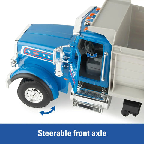Blue Peterbilt 1/16 Scale Dump Truck Toy With Working Dump Bed 20 Inch Construction Vehicle showing steerable front axle feature.