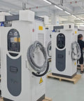 Heavy Duty Commercial Electric Vehicle Charging Station Standalone Level 3 EVSE Fast Charger for Farming and Construction Fleets in a factory setting.