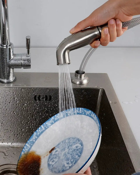 Person using All In One Kitchen Sink Spray Attachment Kit With Hose And Holder Side Sprayer Compatible With Moen And Delta Faucets in brushed nickel