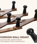 Expandable Accordion Wall Rack For Hats Coats Scarves And Purses Wood X Shape Coat Organizer close-up of peg hooks