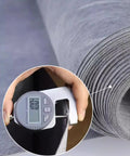 Rock Solid Waterproof Decoupling Membrane Roll 10Mm Thick Polyethylene Tile Underlayment held with caliper for precise measurement.