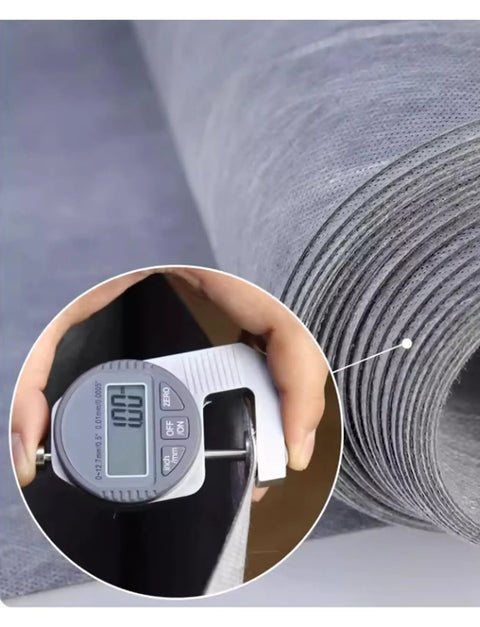 Rock Solid Waterproof Decoupling Membrane Roll 10Mm Thick Polyethylene Tile Underlayment held with caliper for precise measurement.