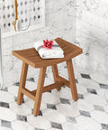 Patented 18 Inch Asia Lotus Teak Shower Bench with folded towel and flower, showcasing stainless steel hardware and rubber feet