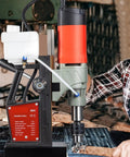 Heavy Duty 1200W Magnetic Drill Press For Steel Structure in use, showing motor and drill working on metal sheet.