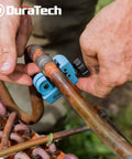 Person using Mini Tubing Cutter For 1/8 To 3/4 Inch Tubing, Cuts Copper Aluminum Brass And Plastic With Replacement Wheel on copper pipe