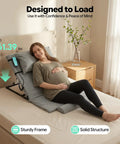 Heavy Duty Electric Lifting Backrest For Bed Supports 661 Lbs With Remote Control Adjustable Sit Up Assist Chair for Elderly To Climb Out Of Bed Easily And Get Lumbar Relief Super Cool, sturdy grey fabric design with remote and user.