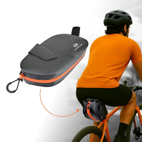 Waterproof Bike Seat Bag With TPU Welded Triangle Frame And YKK Zipper on cyclist's bike, black-orange design. Keeps items dry