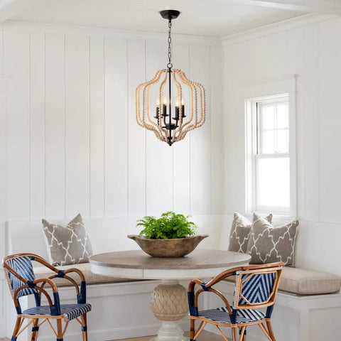 Wood Beaded Chandelier With Four Candle Style Lights For A Cozy Farmhouse Boho Vibe Rustic Ceiling Fixture in a dining nook