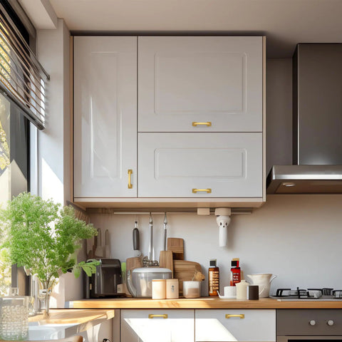 Top Notch Gold Cabinet Pulls For Modern Kitchens on sleek white cabinets in bright kitchen setting.