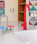 Straight Up Realistic Kitchen Faucet Toy For Kids Pretend Play Sink Accessories in gray and red on a countertop.