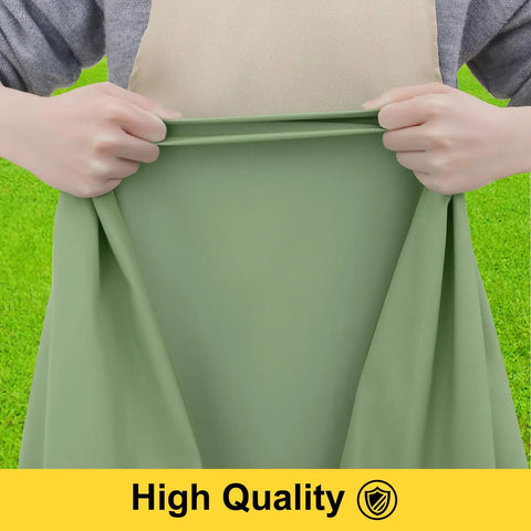 Person stretching sage green waterproof picnic table cover with elastic edge, showcasing quality material.