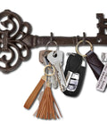 Brown Cast Iron Skeleton Key Wall Hook With Three Heavy Duty Coat Holders showcasing organized keys and accessories.