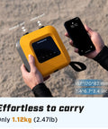 Person holding 20 PSI Electric Paddle Board Pump S1 Portable SUP Air Pump with phone, showing size and weight details.