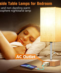 Set Of 2 Bedside Table Lamps With USB Charging Port And AC Outlet illuminating a cozy bedroom setting, soft light over a sleeping woman