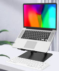 Adjustable Laptop Stand for Desk, Foldable Riser Holder With Ventilated Cooling elevating a laptop beside a plant