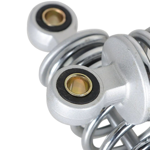 Close-up of Chrome Motorcycle Rear Shock Absorber 320mm Replacement for XL883 1200 72 48 RD350 G1 GS125 150cc, showing end eyelet and spring.
